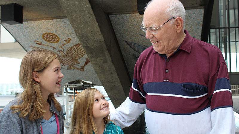 Older veteran and kids at the Eternal Flame