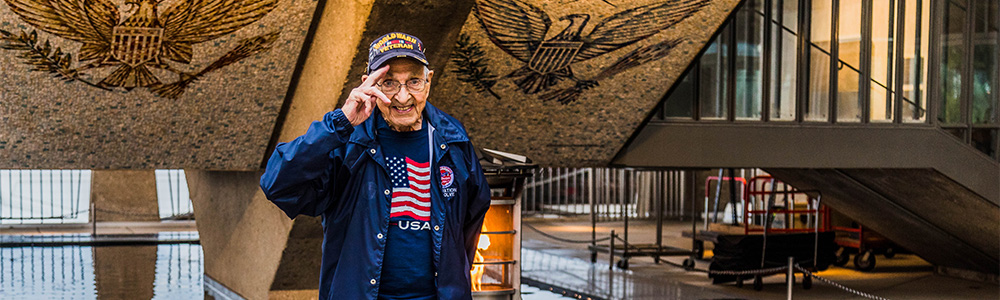 Veteran in front of Memorial Veteran in front of Memorial
